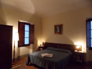 A bed or beds in a room at Il Villino