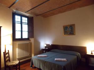 A bed or beds in a room at Il Villino Még 23 kép