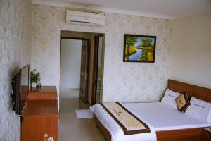 TV a/nebo společenská místnost v ubytování Huynh Duc Hotel
