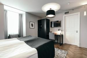Postelja oz. postelje v sobi nastanitve Apótek Hotel Reykjavík by Keahotels