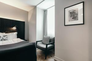 Postelja oz. postelje v sobi nastanitve Apótek Hotel Reykjavík by Keahotels