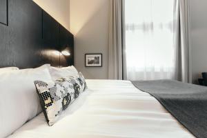 Postelja oz. postelje v sobi nastanitve Apótek Hotel Reykjavík by Keahotels