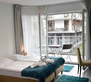 Postel nebo postele na pokoji v ubytování Aparthotel Baltic Spa