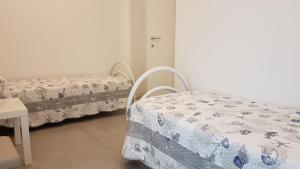 Ένα ή περισσότερα κρεβάτια σε δωμάτιο στο Alma Apartment