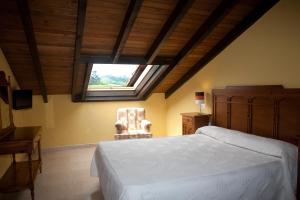 Ein Bett oder Betten in einem Zimmer der Unterkunft Hotel Rural Porrua