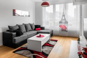 a living room with a couch and a coffee table at Flexible SelfCheckIns 7 - Zagreb - Garage - Electric vehicle ccharger - Loggia - New - Luxury - Apartments Repinc 7 in Zagreb