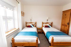 Letto o letti in una camera di Nellie Dee's - Room Only