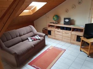 a living room with a couch and a table at Ferienwohnungen Grill in Schönberg