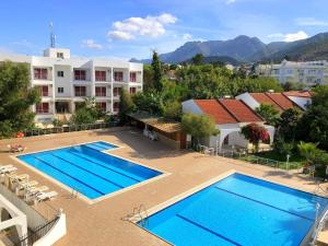 an image of a swimming pool at a resort at Rose Gardens Boutique & Pool & Restaurant in Kyrenia