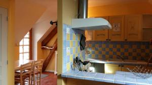 a kitchen with a sink and a counter top at 21 rue de l'Olivet in Orbigny