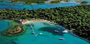 an aerial view of a island with boats in the water at Nana Hotel in Kamena Vourla
