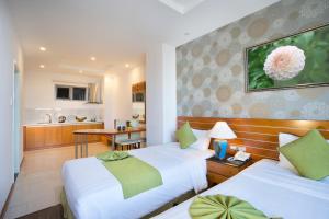 Postel nebo postele na pokoji v ubytování Richico Apartments And Hotel