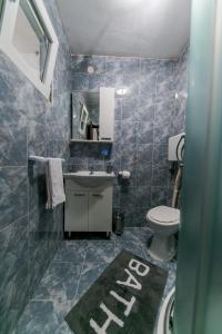 Ett badrum på Apartments Vukman