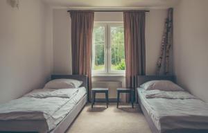 Posteľ alebo postele v izbe v ubytovaní Hotel Dwa Księżyce