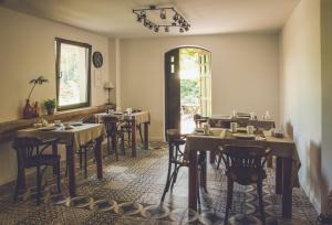 a restaurant with tables and chairs in a room at Hotel Dwa Księżyce in Toruń