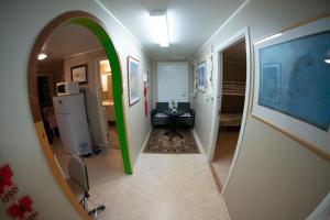 a hallway with an archway in a room at Beijing home in Tromsø