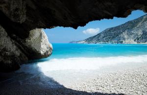 a view of a beach from inside a cave at Muses Studios Sami in Sami