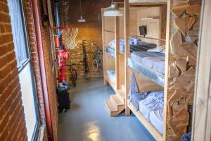 a room with bunk beds and a basketball hoop at PodShare DTLA in Los Angeles