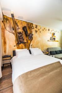 a bedroom with two beds and a wall with music notes at GraffitiSuites#Bronze in Thessaloniki