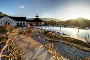 a large swimming pool with a building and a church at Madonna Inn in San Luis Obispo