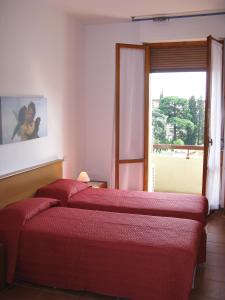 Postel nebo postele na pokoji v ubytování Mio Hotel Firenze