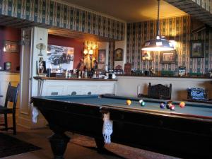 a billiard room with a pool table in it at Unique GolfLodge in Santo Domingo