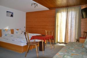 A bed or beds in a room at Pension Armella