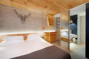Krevet ili kreveti u jedinici u okviru objekta Rogla – Hotel Rogla