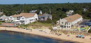 an aerial view of a beach with a group of people at The Corsair & Cross Rip Oceanfront in Dennis Port