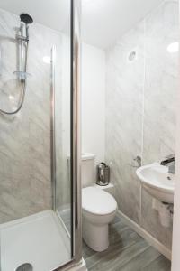 a bathroom with a shower and a toilet and a sink at Ripley Peak District Gateway in Ripley