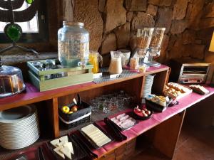 a table with some food on top at Enclave Soria in Herreros