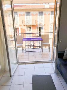 a view of a balcony with a table and chairs at Portobello residence in Nice