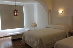 Postel nebo postele na pokoji v ubytování Hotel Aldea del Bazar & Spa