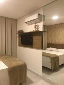 En eller flere senge i et værelse på Apartamento Beach Class Eco Life