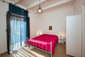 A bed or beds in a room at Camere Simona