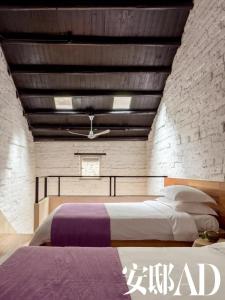 Postel nebo postele na pokoji v ubytování XY·Yun House