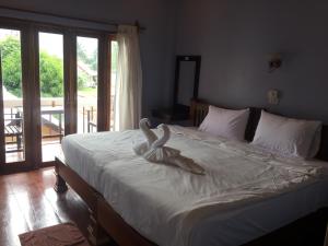 Cama o camas de una habitación en Pongkham Residence