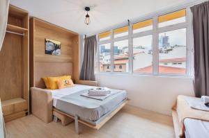 Postel nebo postele na pokoji v ubytování hipstercity hostel