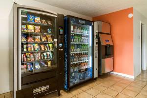 two refrigerators in a room with food and drinks at Motel 6-New Stanton, PA in New Stanton