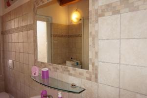 a bathroom with a sink and a mirror at Bergamum F.L. in Bergamo
