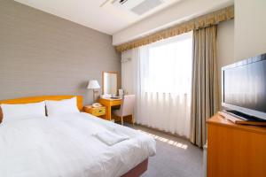 Кровать или кровати в номере Bright Park Hotel
