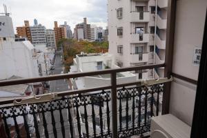 a balcony with a view of a city at CUBIC.30 in Hiroshima