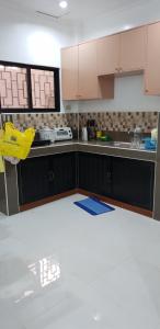 a kitchen is being remodeled with a white floor at KDC Homes (Gold) in Puerto Princesa City