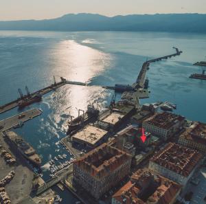 an aerial view of a harbor in the water at Point Rijeka in Rijeka