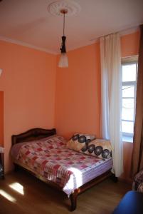 Postel nebo postele na pokoji v ubytování Dodo Japaridze Guesthouse