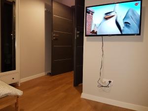 En tv och/eller ett underhållningssystem på Arkadia Hostel