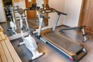 a gym with several exercise bikes in a room at Focus Hotel Gdańsk in Gdańsk