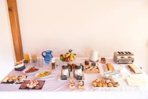 a table with various breakfast foods on it at Il Giardino di Venere in Mondello