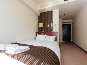 Postel nebo postele na pokoji v ubytování Sky Heart Hotel Koiwa