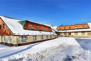 a group of buildings with snow on the ground at RS Budoucnost in Frýdlant nad Ostravicí